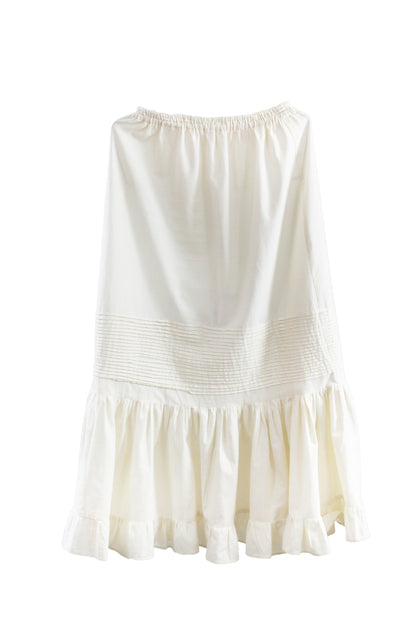 Falda alforzas de lino color beige, vista frontal.